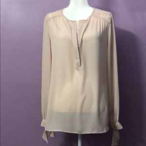 Light pink blouse; lace shoulders